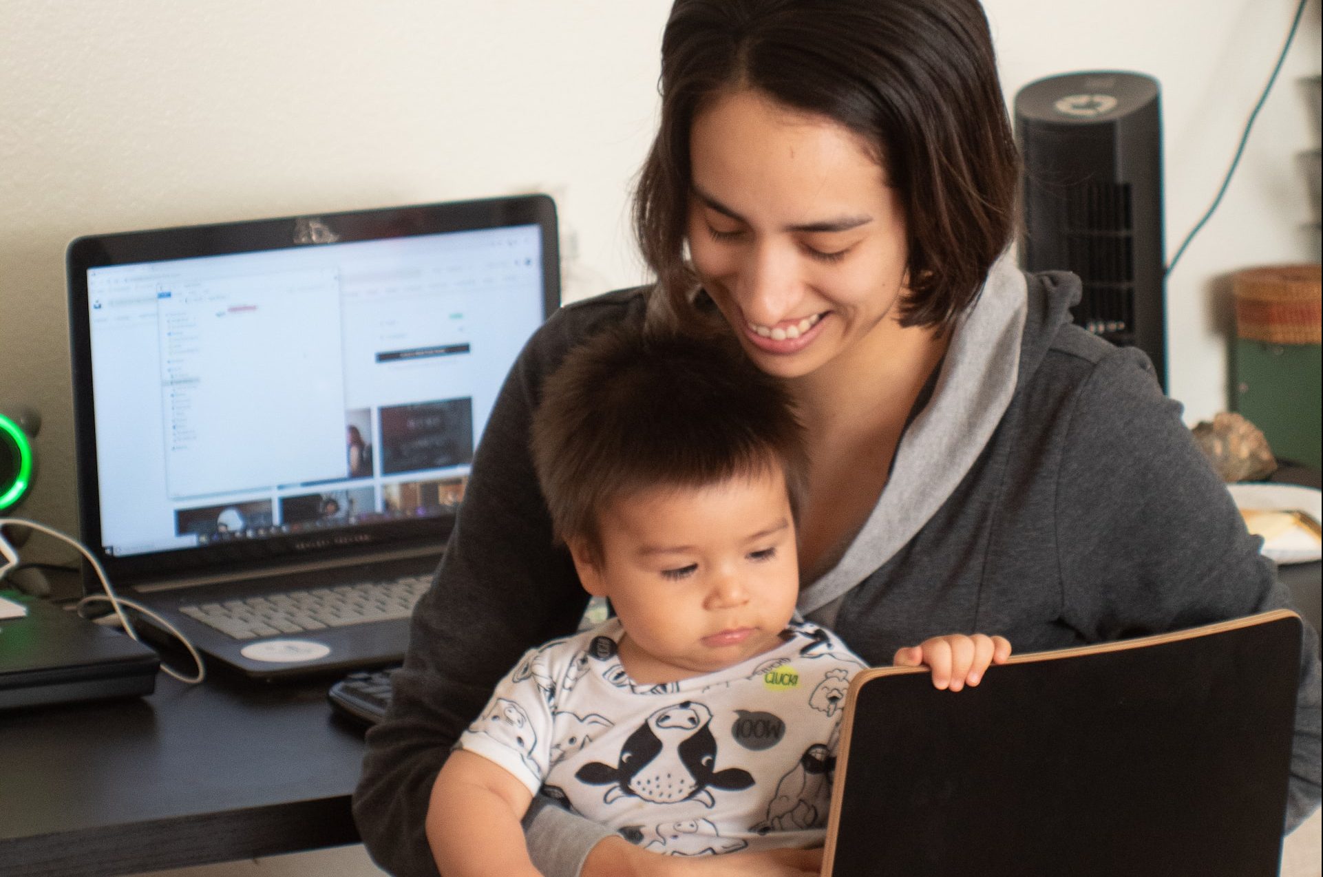 Mum with a son in front of the computer